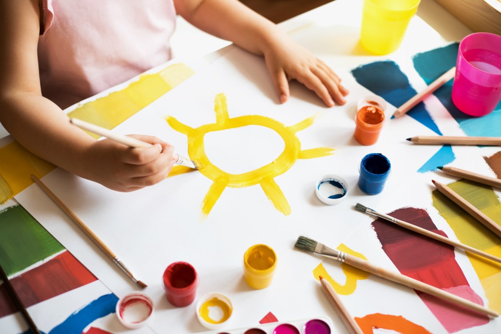 child painting a sun - programs 